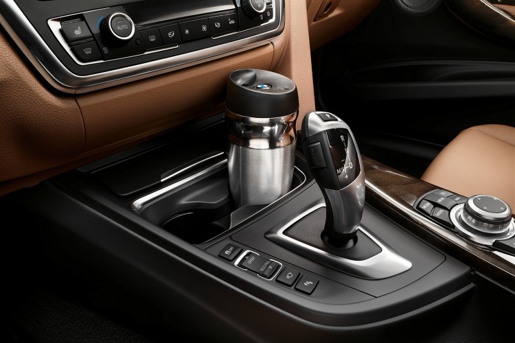 Gyroscopic, anti-spill cup holders exist and they're from BMW