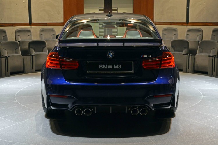BMW M3 Sedan in Tanzanite Blue with carbon fiber rear wing