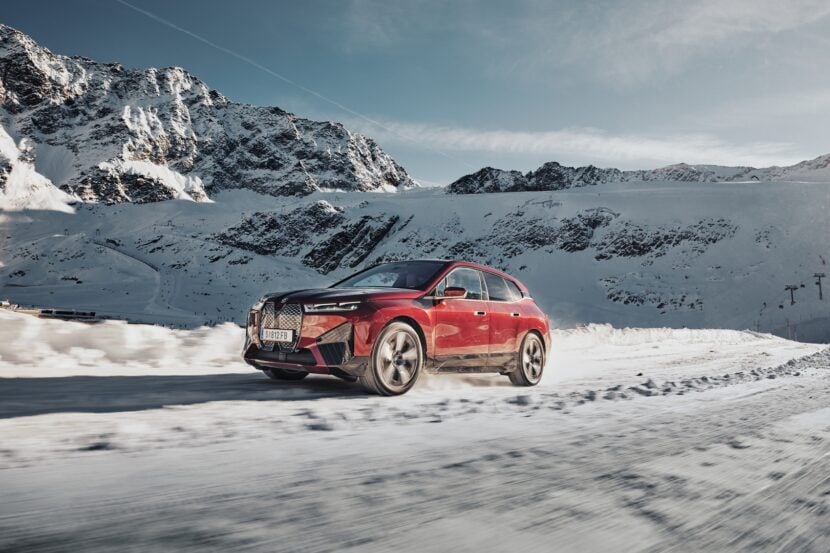 BMW iX electric crossover plays in the snow