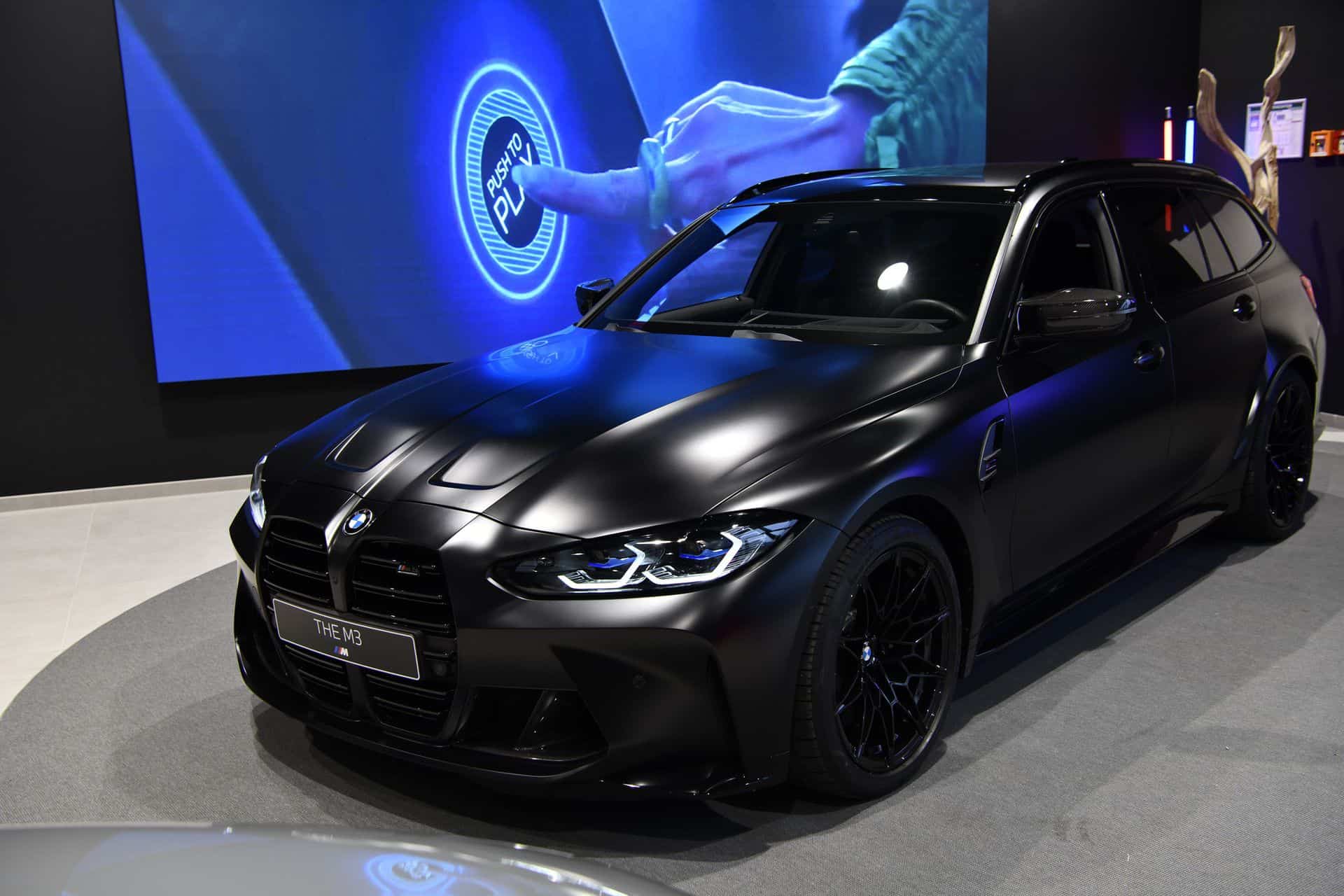 All-Black Bmw M3 Touring With Matte Paint Poses For The Camera