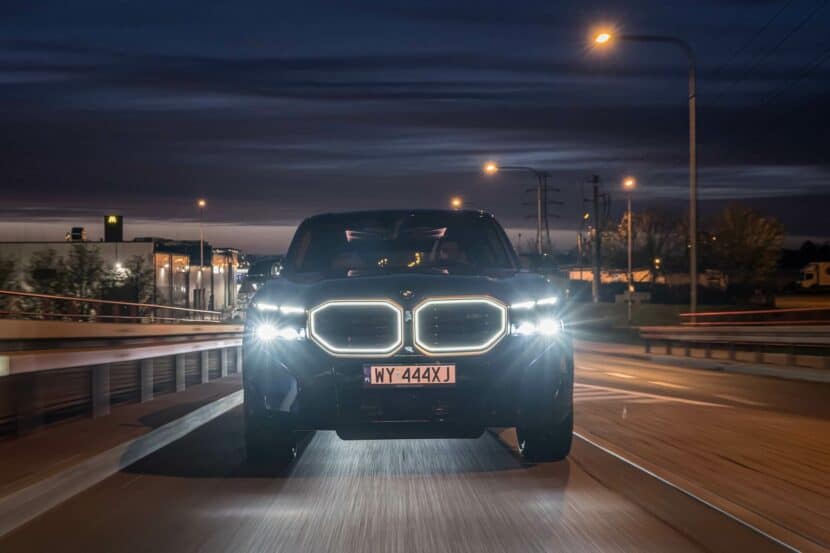 2024 BMW XM from the front, headlights and front grille illuminated